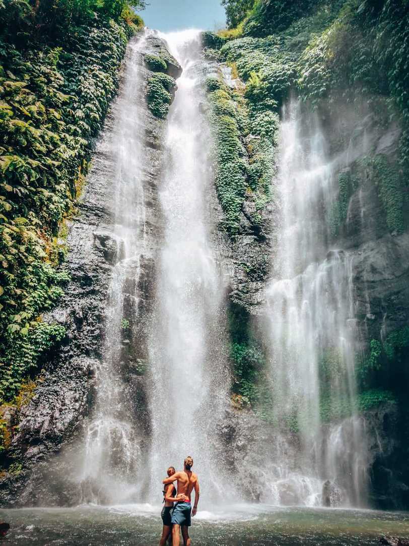 Sekumpul Waterfall - couple in the waterfall pool